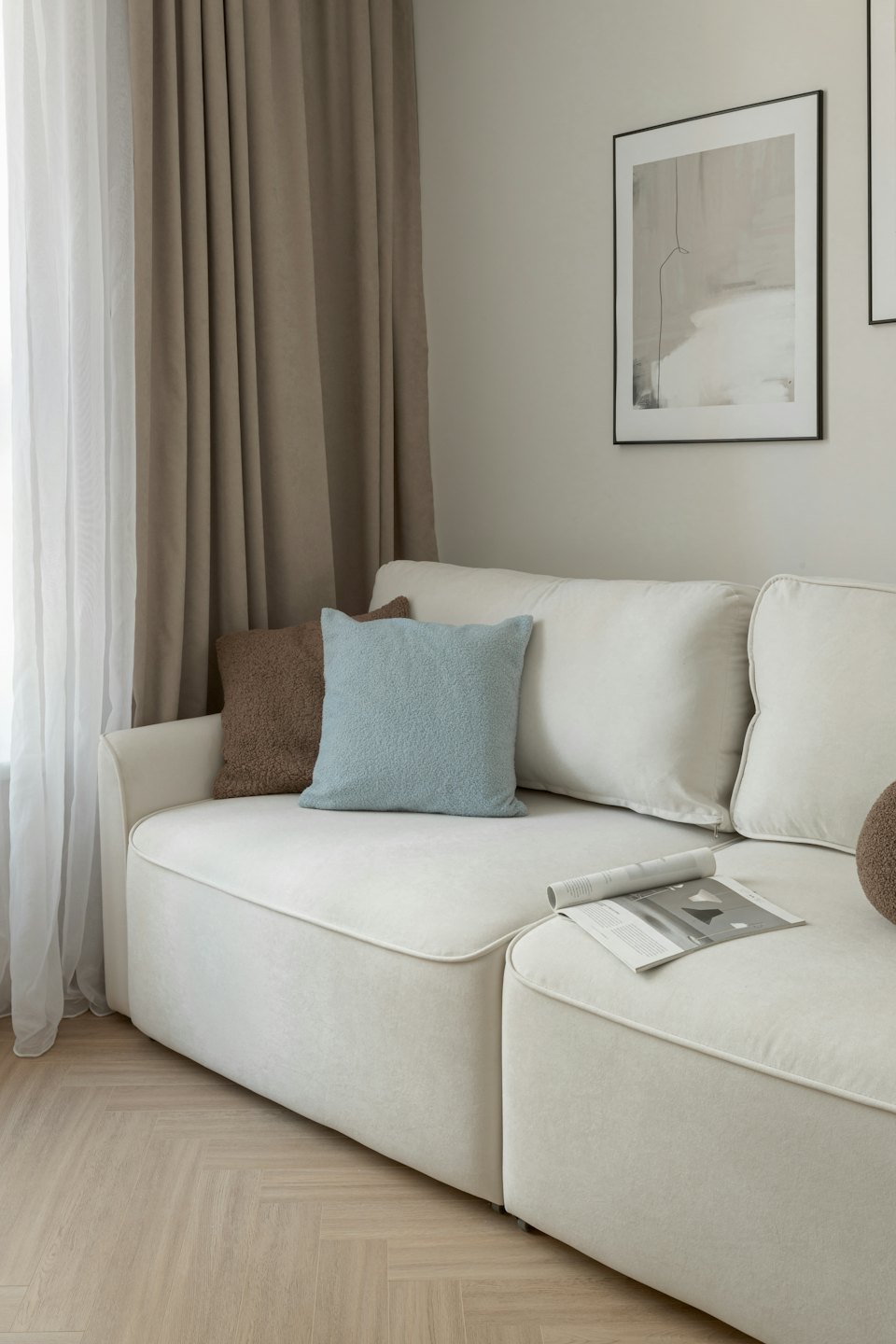 Modern living room featuring a sofa with textured cushions.